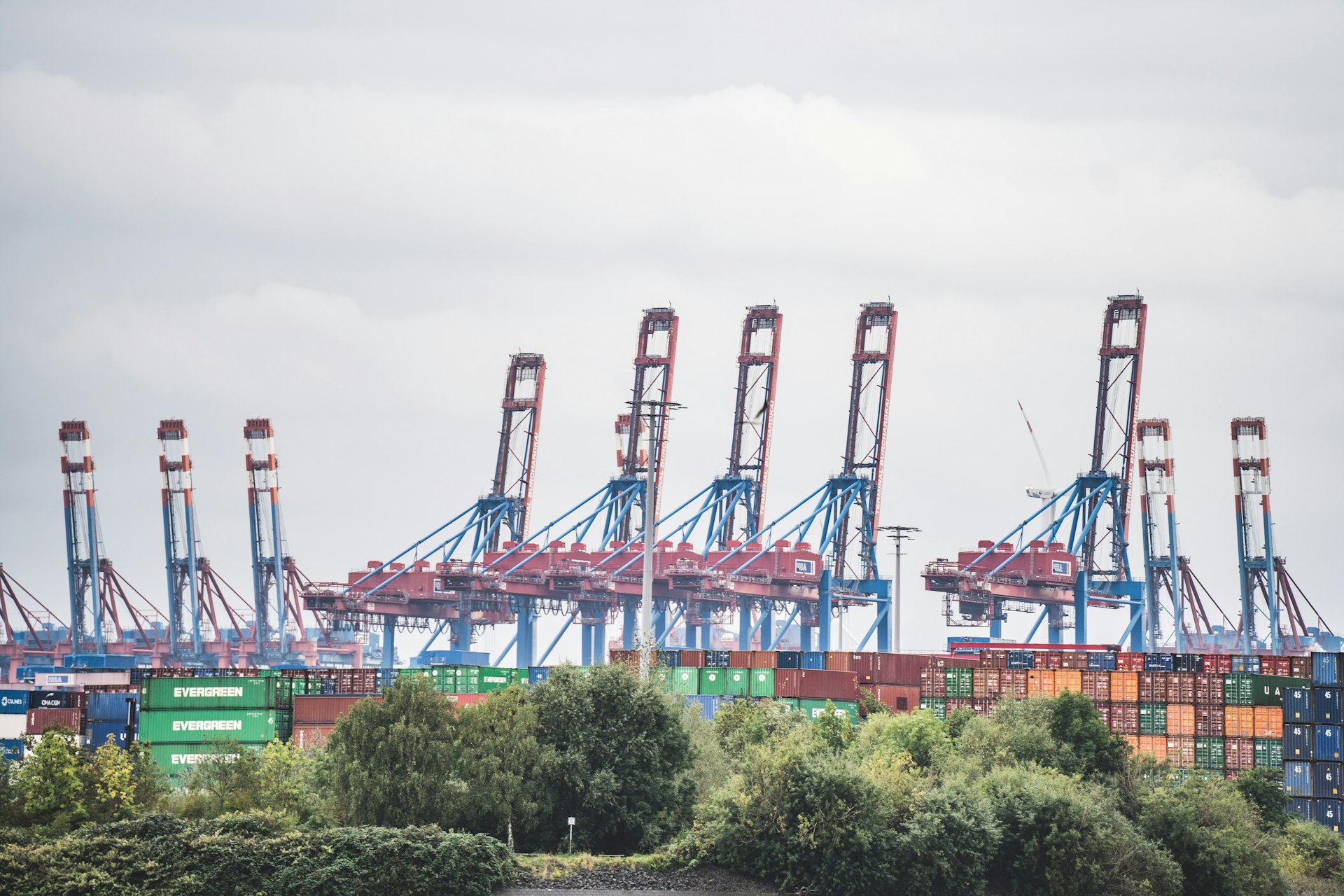 a bunch of cargo containers are stacked on top of each other